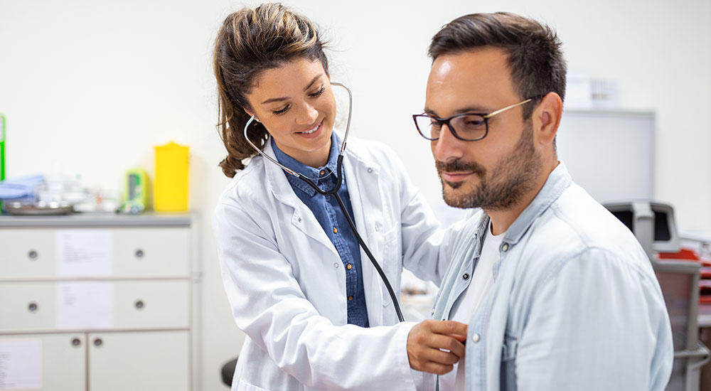 Doctor checking patient by a stethoscope
