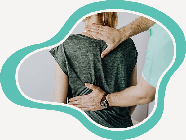 Doctor checking the condition of the spine of a female patient