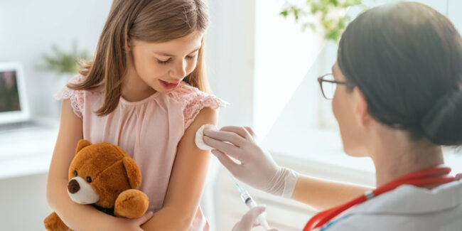Doctor doing vaccine to child