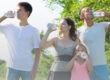 Family drinking water during a summer outdoor activity- Staying hydrated before, during, and after outdoor activities can help prevent dehydration and heat-related illness.