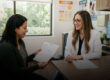Primary care physician discussing vitamin D deficiency, blood test results, and preventive health with an adult patient.