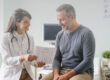 Primary care physician discussing elevated triglyceride results with an adult patient.